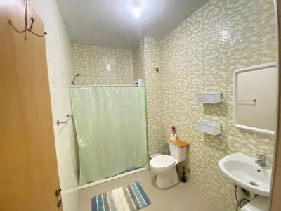 a bathroom with a shower and a toilet and a sink at Guest house B&S in Praia