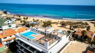 an aerial view of a hotel and the beach at Sal Sol & Mar - Flor de Sal in Santa Maria