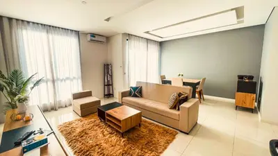 a living room with a couch and a table at Prestige Apartment in Praia