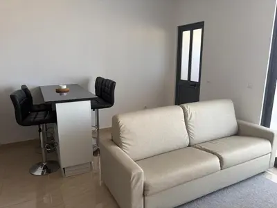 a living room with a couch and a table at Apartamento Teixeira 2 in Espargos