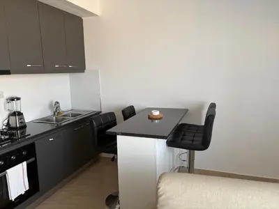 a kitchen with black cabinets and a counter top at Apartamento Teixeira 2 in Espargos