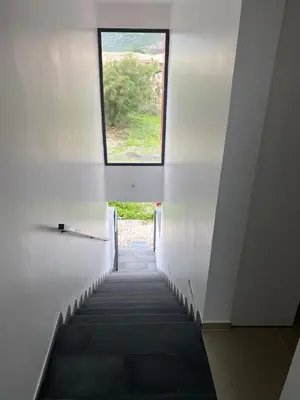 a stairway with a window in a building at Casa Uta in Tarrafal