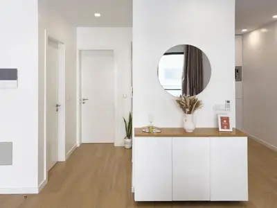 a white kitchen with a mirror and a counter at Cozy 1-bdr apt, Cidadela - LCGR in Praia