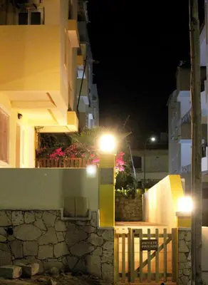 a building with lights on the side of it at night at Flat 4U in Santa Maria