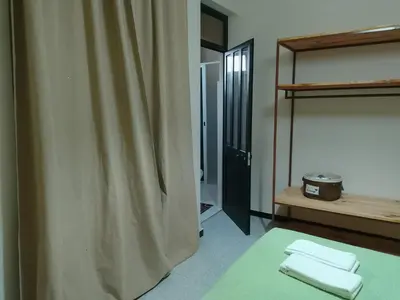 a bathroom with a shower curtain in a room at Essencia Sterra in Praia