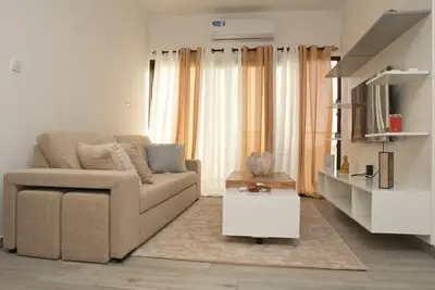 a living room with a couch and a coffee table at Comfort and Peace in Santa Maria