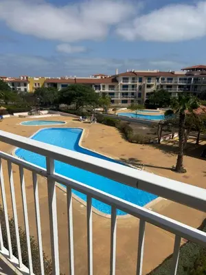 a view of two swimming pools from a balcony at Vila Verde House in Santa Maria