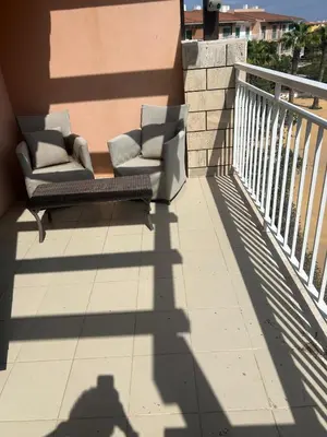 a shadow of a person standing on a balcony at Vila Verde House in Santa Maria