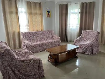 a living room with two chairs and a coffee table at Very nice 5 bedroom apartment in Tarrafal in Tarrafal