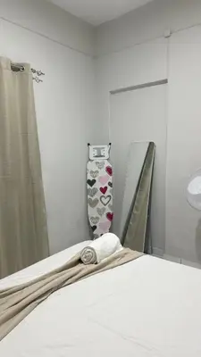a bedroom with a bed and a vase with hearts at T2 Vacation in Mindelo in Mindelo
