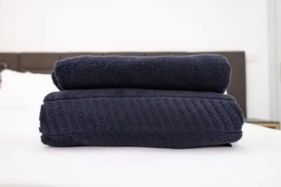 a pile of towels sitting on top of a table at Apart'hotel Assomada in Assomada