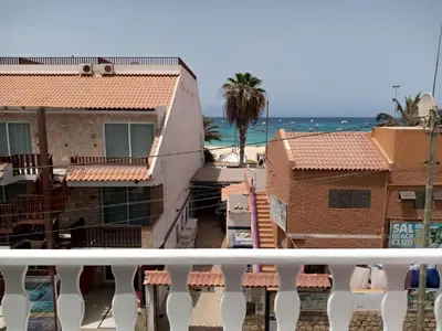 a view of houses and the ocean from a balcony at Soleil A5 - Lovely and central apartment in Santa Maria