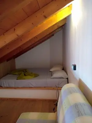 a bedroom with two beds in a loft at Soleil A5 - Lovely and central apartment in Santa Maria
