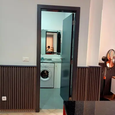 a bathroom with a washing machine and a mirror at Ca' Estrella Santa Maria Sal in Santa Maria