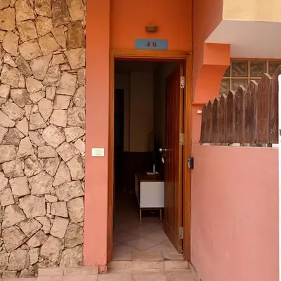 an entrance to a building with a stone wall at Ca' Estrella Santa Maria Sal in Santa Maria