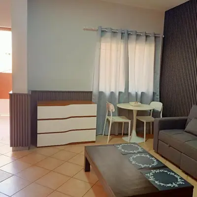 a living room with a couch and a table at Ca' Estrella Santa Maria Sal in Santa Maria