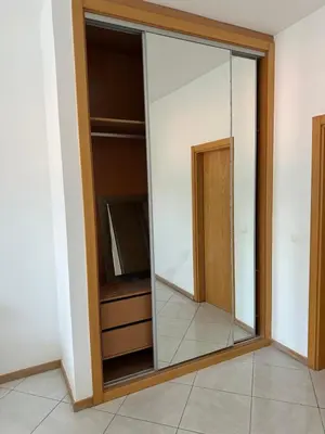a large mirror in a room with a tv at Condominio atlantico ll in Praia
