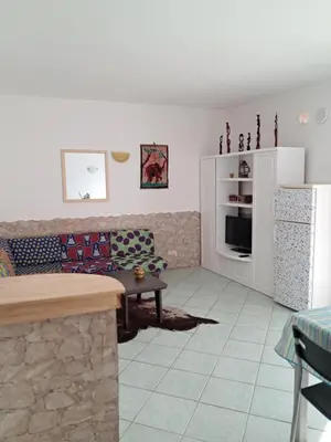 a living room with a couch and a table at Cà Giasone in Santa Maria