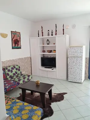 a living room with a couch and a coffee table at Cà Giasone in Santa Maria