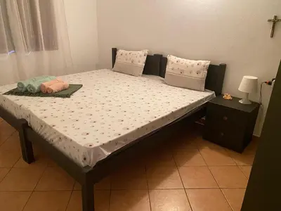 a bed in a room with a mattress and pillows at Porto Antigo, o Paraíso na ilha do Sal, no centro de Sta Maria in Santa Maria