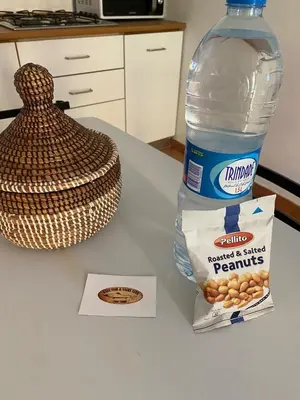 a bottle of water and a bag of peanuts on a table at Porto Antigo, o Paraíso na ilha do Sal, no centro de Sta Maria in Santa Maria