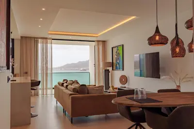 a living room with a couch and a table at Nusa Apartments Monte Cara in Mindelo