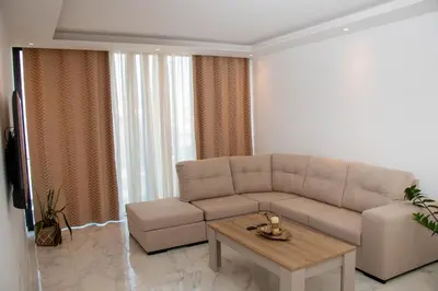 a living room with a couch and a coffee table at Fresh One Too Apartment in Praia