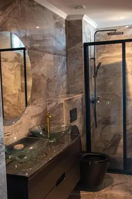 a bathroom with a glass sink and a shower at Fresh One Too Apartment in Praia