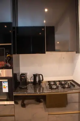a kitchen with a stove and a counter top at Fresh One Too Apartment in Praia
