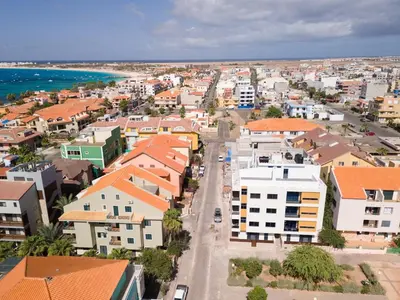 an aerial view of a city with buildings and the ocean at New building - 1 min away from the main road in Santa Maria