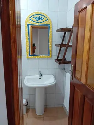 a bathroom with a sink and a mirror at B&B Casa Boho