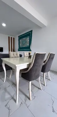 a white table and two chairs in a room at Salinas Breeze in Santa Maria