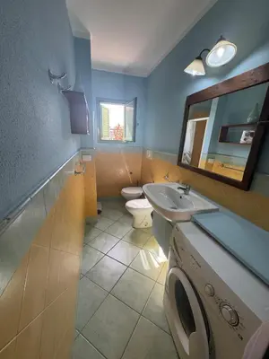a bathroom with a toilet and a sink and a mirror at Holiday Properties Djadsal Pirata - Wi-fi in Santa Maria