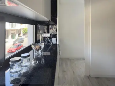 a counter with some vases on it in a room at 2-bdr bright apt central street cidadela - LCGR in Praia