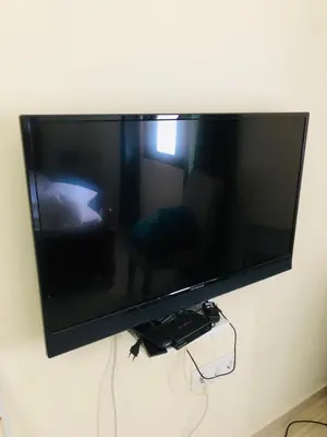 a flat screen tv hanging on a wall at Residencial Palice