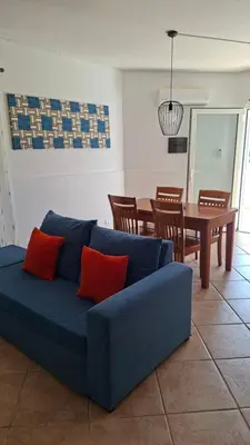 a blue couch in a living room with a table at Star House Murdeira, Sal Island, Cape Verde in Beirona