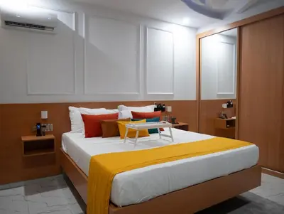 a bedroom with a large bed with a table on it at Top-Level Pool in Praia