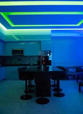 a room with blue and green lights on the ceiling at Top-Level Pool in Praia