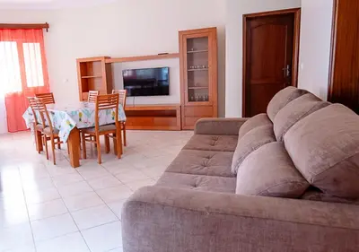 a living room with a couch and a table at Residencial Mendes in Tarrafal