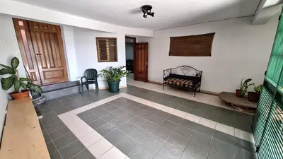 a living room with a couch and a table at Kaza Manata in Praia