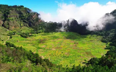 an aerial view of a green field on a mountain at Casa Azul in Paul