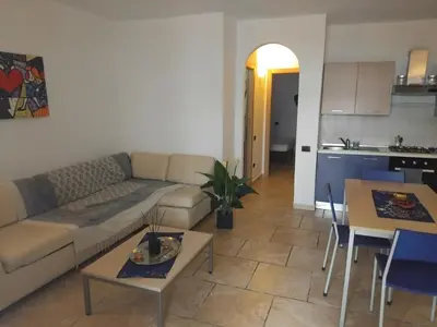 a living room with a couch and a table at Moradias No Stress in Santa Maria
