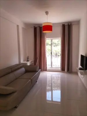 a living room with a couch and a window at Cozyapartment Povoacao, Rbra GrandeSanto Antao in Ribeira Grande