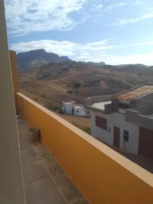 a view of the mountains from a balcony of a building at Ma maison de cha de marhina in Mindelo