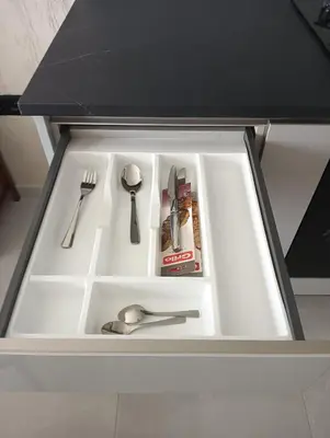 a white kitchen sink with utensils in it at Ocean View Studio 1 in Mindelo