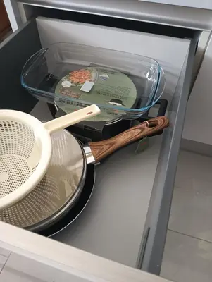 a drawer with a strainer and a wooden spoon at Ocean View Studio 1 in Mindelo