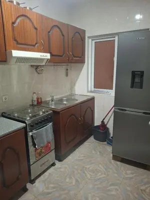 a kitchen with a stove and a sink and a refrigerator at kaza sz in Praia