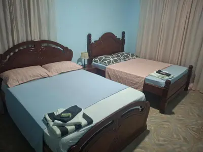 two beds in a room with two beds sidx sidx sidx at kaza sz in Praia