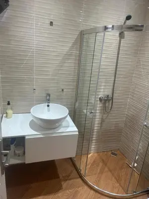 a bathroom with a sink and a shower at Morabeza Lodge in Mindelo