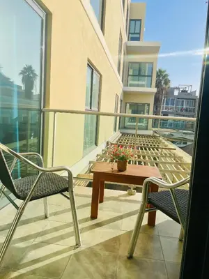 a balcony with a table and chairs on a building at Sal Little Heart Sun NEW Apartment 5 in Santa Maria